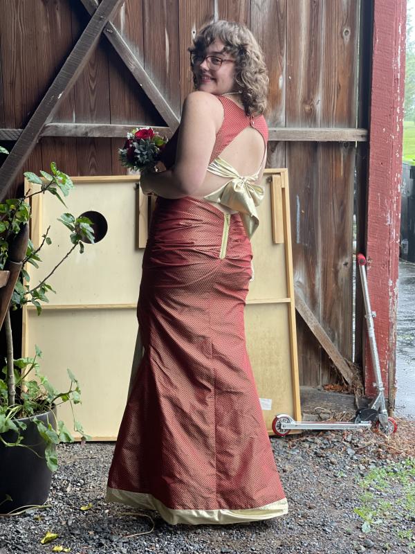 Senior Gwen Gofus designed a classic, vintage-look cranberry and gold gown.